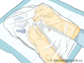 gloved hands emptying open capsule into dissolve-and-dose device