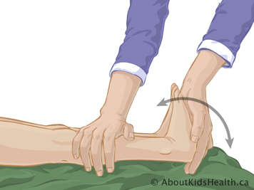Hand pushing child&rsquo;s foot upward toward their head with the leg held straight