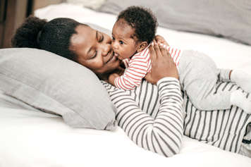 Baby lying on mother's chest