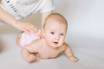 Baby showing flat tummy time