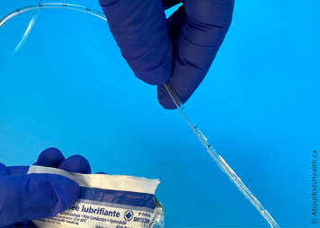 Lubricating the sides of the suction catheter with a water-soluble lubricant