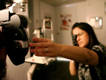 An optometrist assessing prescription lenses