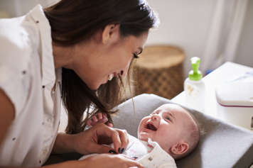 Mother and baby looking at each other and smiling