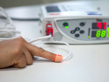 An oxygen saturation monitor on a finger