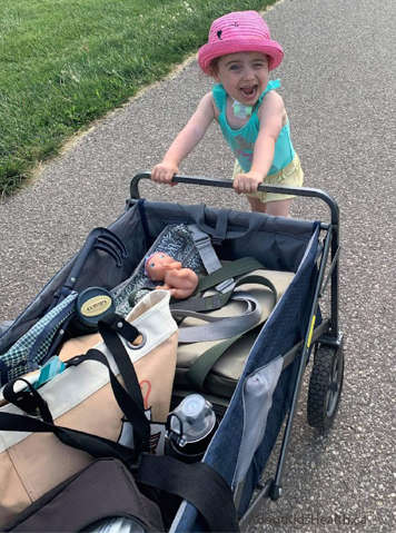 Child with a tracheostomy pushing a wagon